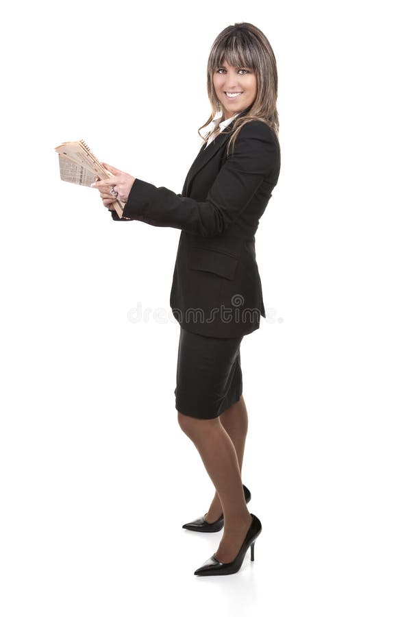 Beautiful young businesswoman holding newspaper