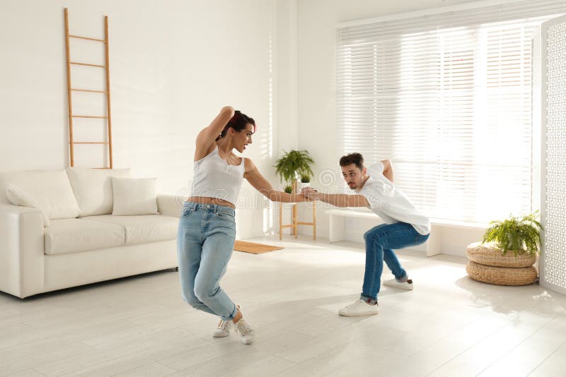 Beautiful Young Couple Dancing in Living Room Stock Image Image of