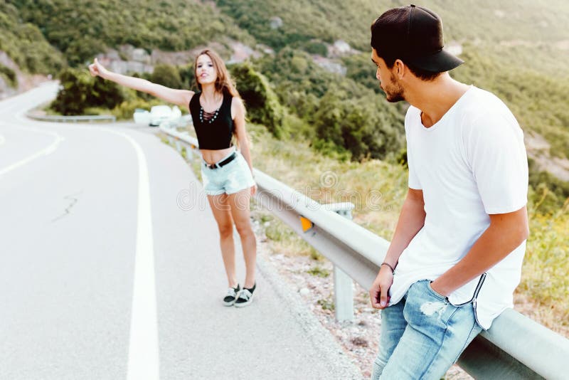 Beautiful young couple enjoying nature on mountain. stock photo Beautiful young couple enjoying nature on mountain. stock photo