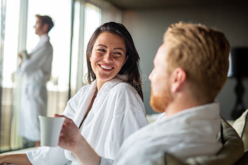 Beautiful young couple enjoying and relaxing in SPA center. People enjoying weekend, holiday royalty free stock image