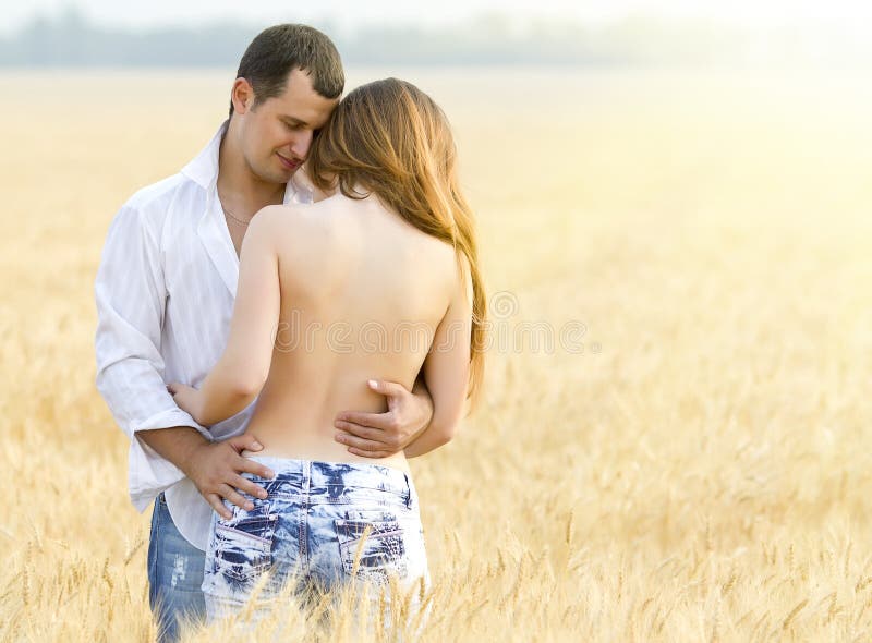 Beautiful young couple in field