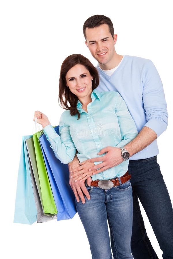 Beautiful young couple with shopping bags