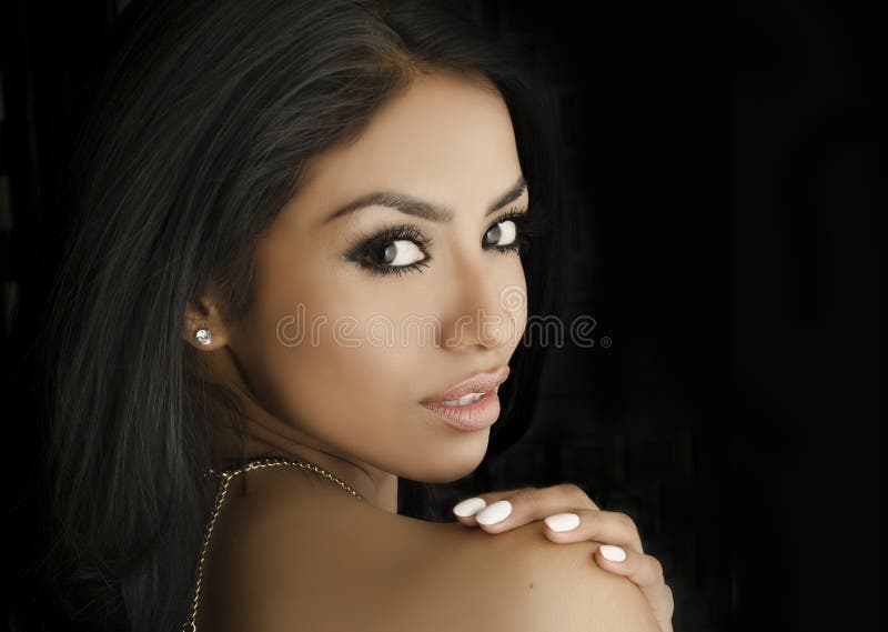 Beautiful young exotic woman wearing dress