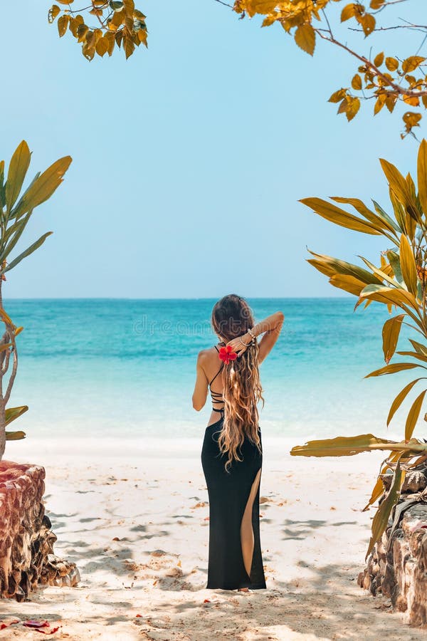 Beautiful Young Fashionable Woman in Black Dress Posing at the Beach ...