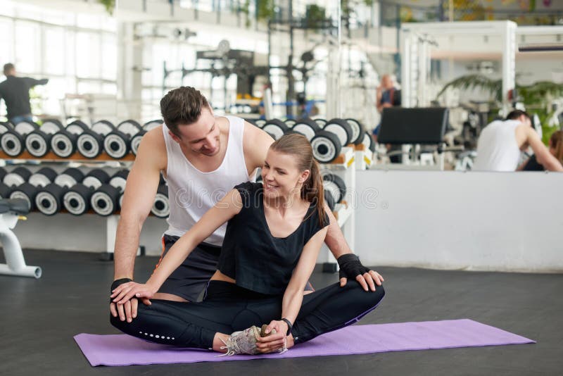 https://thumbs.dreamstime.com/b/beautiful-young-fitness-couple-gym-men-women-practicing-yoga-together-club-203393905.jpg