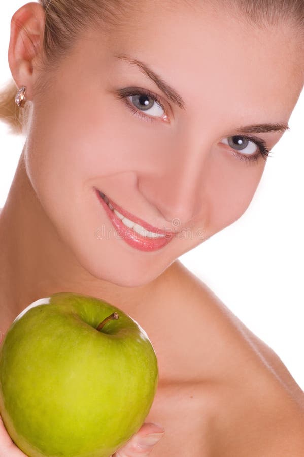 Beautiful young girl with green apple