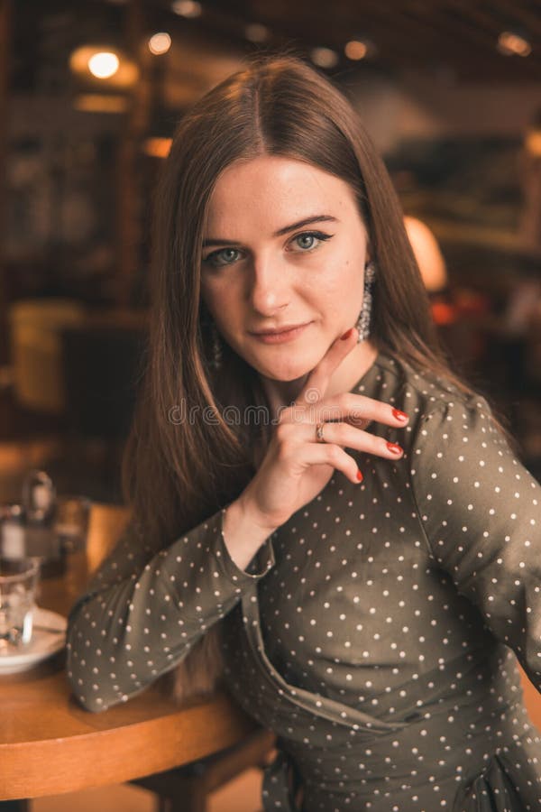 Young Girl in Cafe in Green Dress Stock Ph