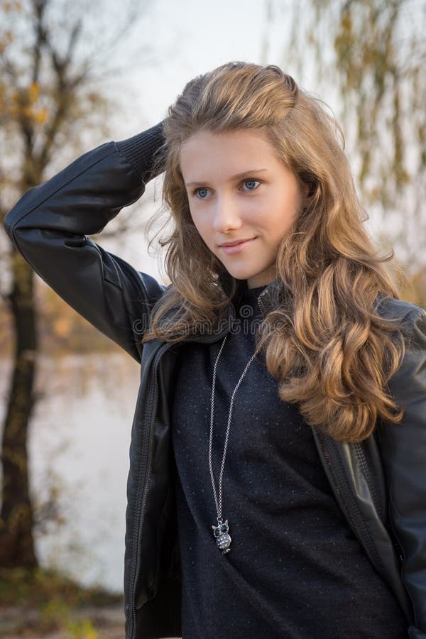 Beautiful young girl outdoors royalty free stock photos