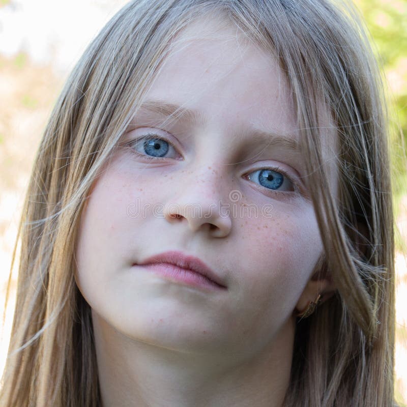 Beautiful young girl outdoors, portrait children close up