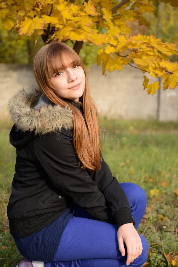 Beautiful young girl with red hair