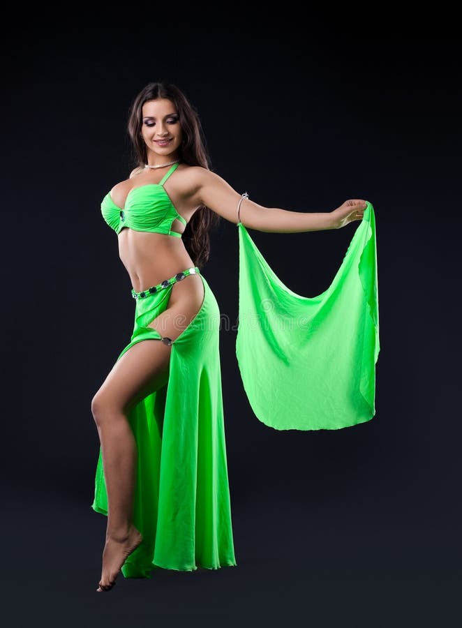 Beautiful young girl stand in green arabic costume