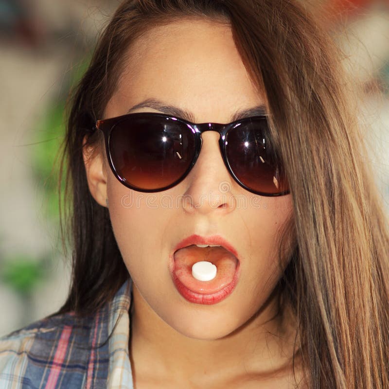 Beautiful Young Girl In Sunglasses Is Going To Swallow Pills Stock 