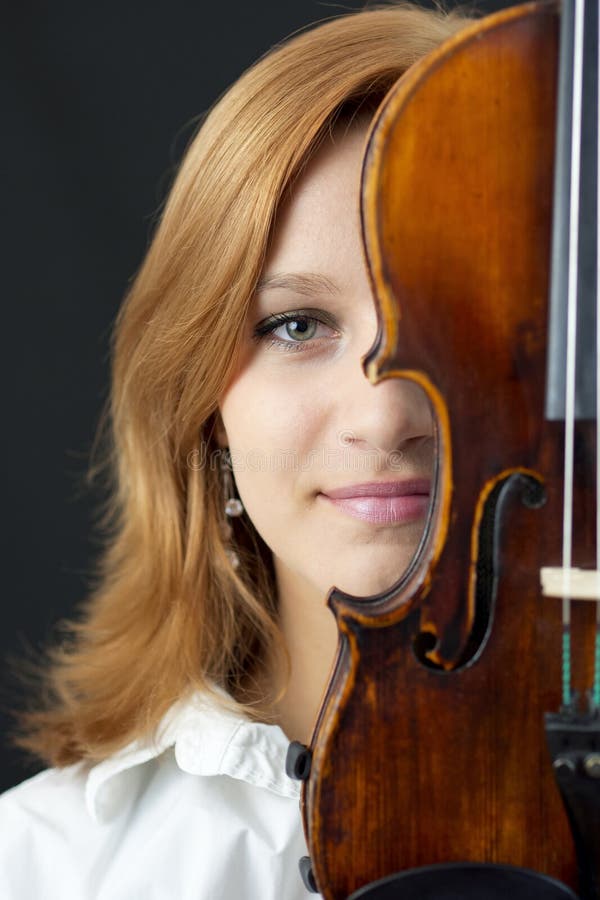 Beautiful young girl with violin royalty free stock image