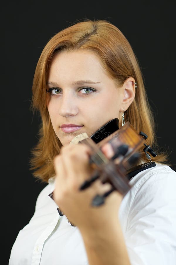 Beautiful young girl with violin stock photography