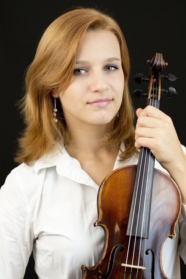Beautiful young girl with violin royalty free stock photography