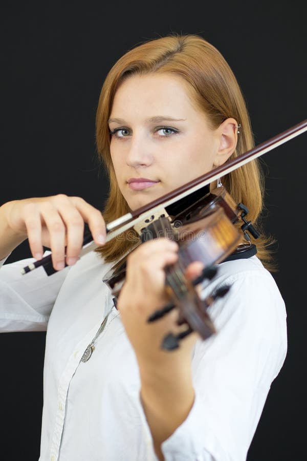 Beautiful young girl with violin royalty free stock image
