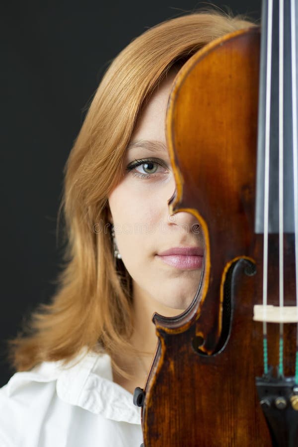 Beautiful young girl with violin stock photo
