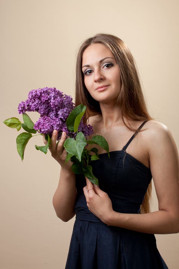 Beautiful Young Girl Weared in Black Dress with a Bouquet of Lilac ...