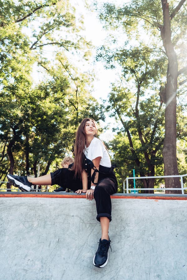 Beautiful Young Hipster Girl Sitting on the Edge of a Ramp Stock Image ...