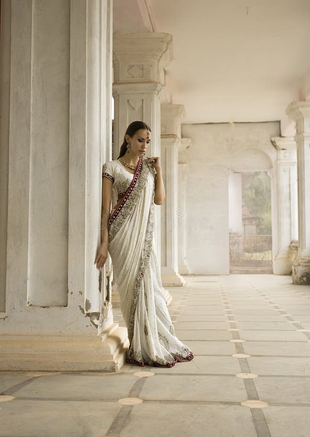 Beautiful young indian woman in traditional clothing with bridal