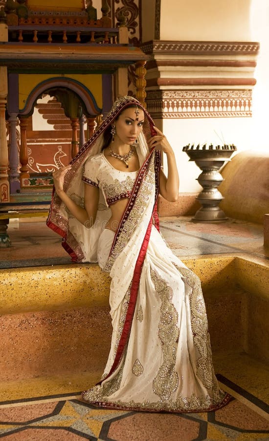 Beautiful young indian woman in traditional clothing with bridal stock photo Beautiful young indian woman in traditional clothing with bridal stock photo