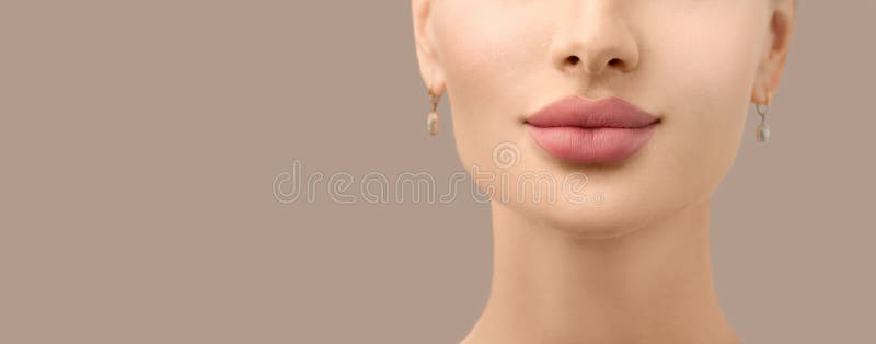 Beautiful young model face closeup. Lip filler injections. Fillers. Lip augmentation. Perfect Lips with hyaluronic acid