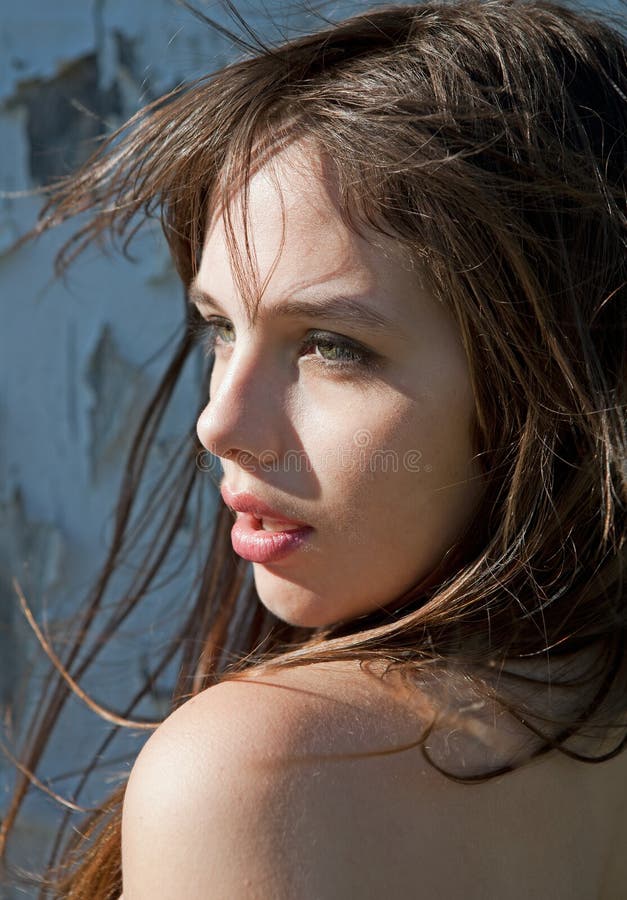 Beautiful Young Model With Hair Blowing in Wind