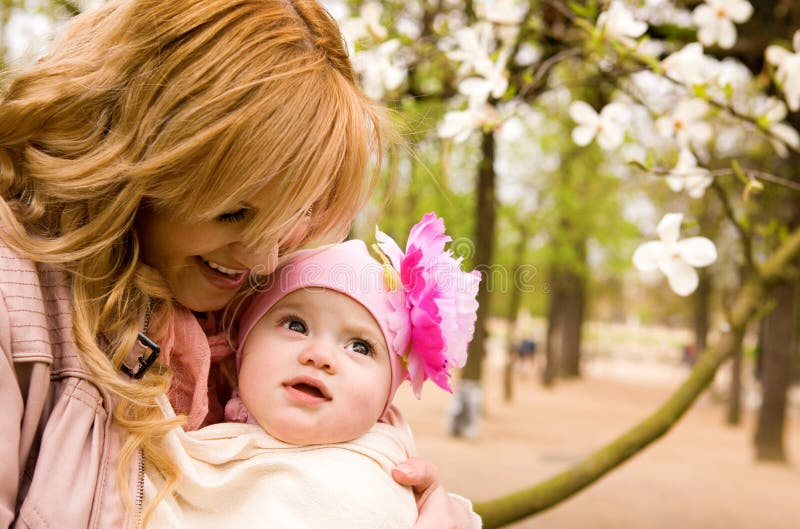 Beautiful young mother with her baby daughter