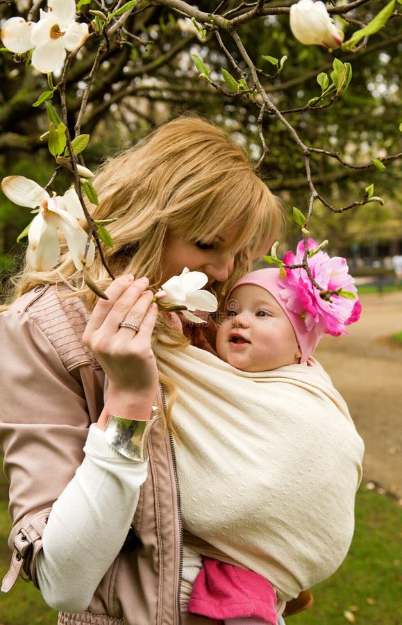 Beautiful young mother with her baby daughter