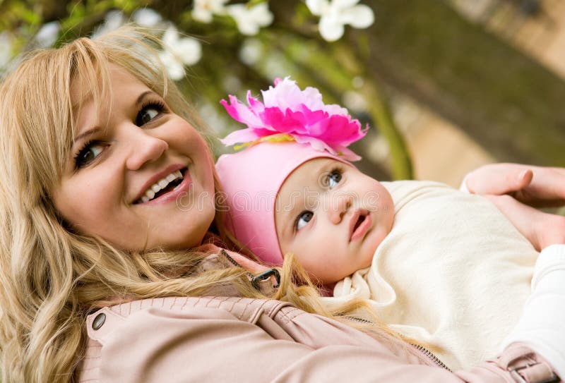 Beautiful young mother with her baby daughter