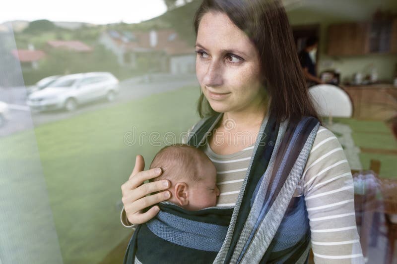 Mother Carrying Her Baby In A Sling Stock Images - Image 