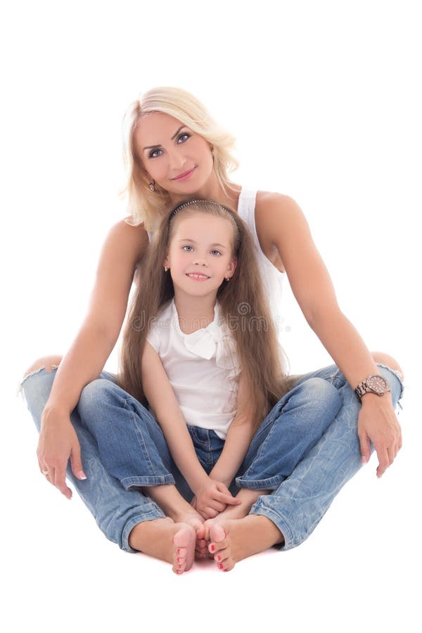 Beautiful young mother sitting with little daughter isolated on