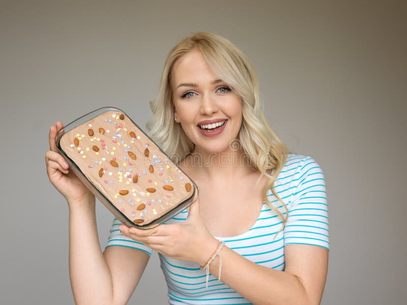 Beautiful young retro pinup woman with sweet cake stock image Beautiful young retro pinup woman with sweet cake stock image