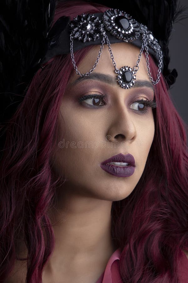 A Beautiful South Asian Woman Wearing an Animal Print Dress and Posing ...