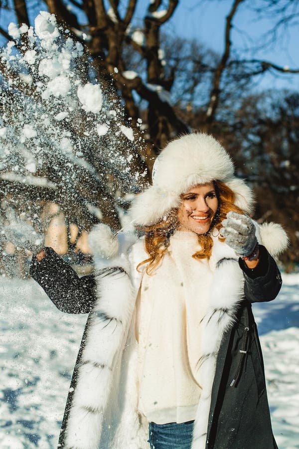 Beautiful Young Winter Woman Smiling and Playing Snowballs Stock Photo ...