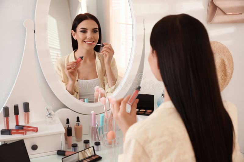 Beautiful Young Woman Applying Makeup Near Mirror Indoors Stock Image ...