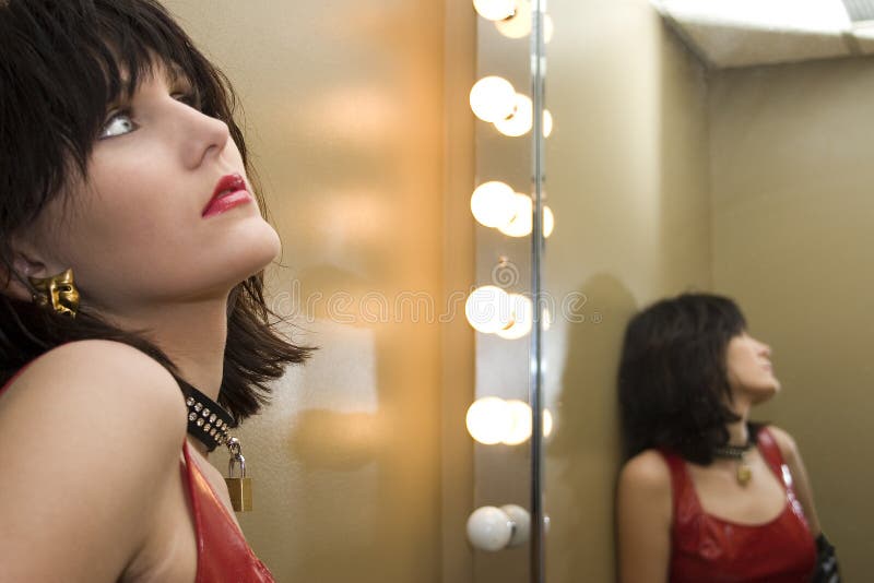 Beautiful Young Woman In Bathroom Mirror