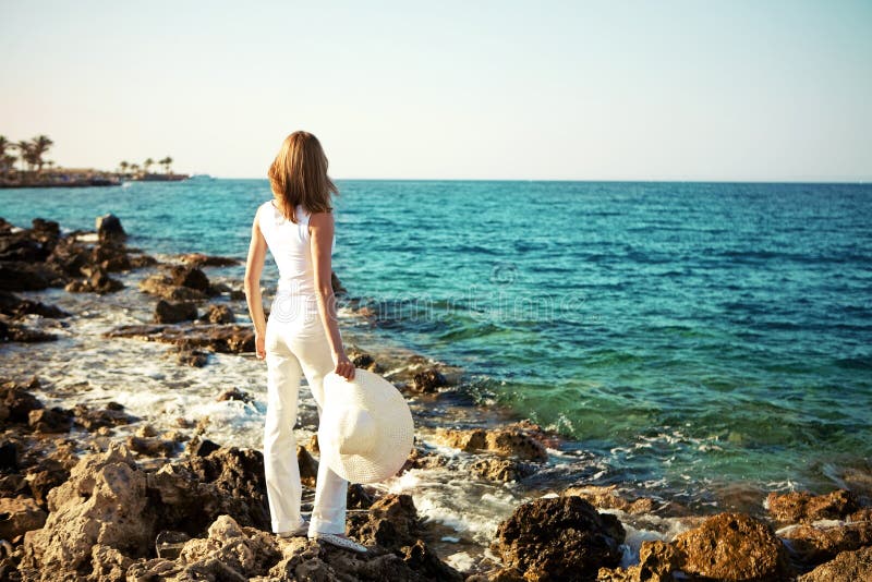 Beautiful young woman on the beach