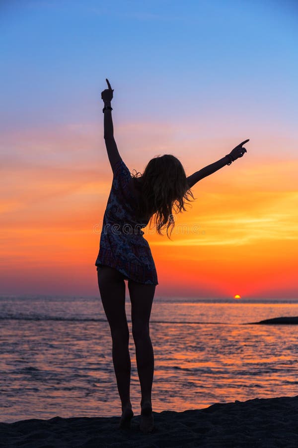 Beautiful Young Woman on the Beach at Sunset Stock Photo - Image of ...