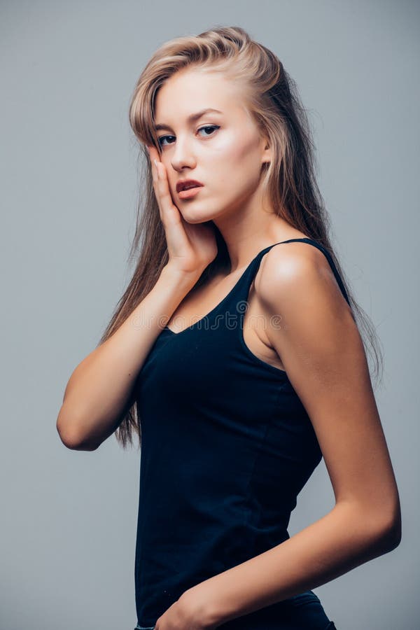 Beautiful Young Woman in Black Shirt on Grey Background Stock Image ...