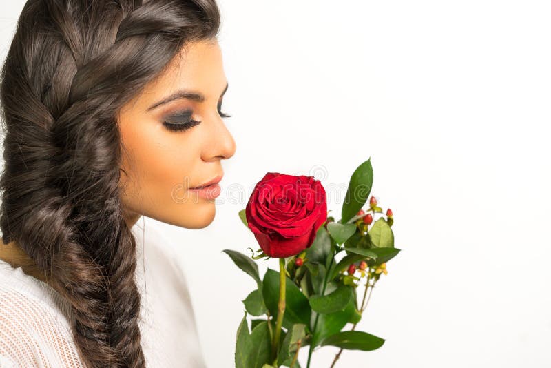 Beautiful young woman braided hair red rose stock photo Beautiful young woman braided hair red rose stock photo