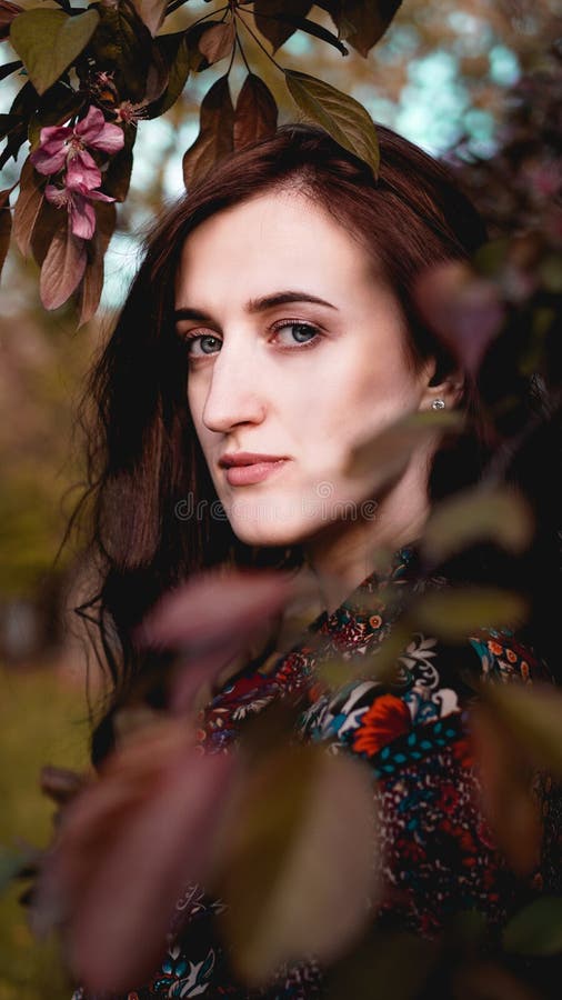 Beautiful young woman in burgundy leaves royalty free stock image Beautiful young woman in burgundy leaves royalty free stock image