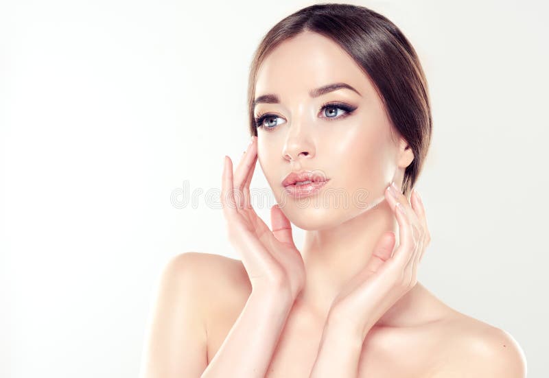 Beautiful young woman with clean fresh skin. Cosmetic and cosmetology. royalty free stock photo Beautiful young woman with clean fresh skin. Cosmetic and cosmetology. royalty free stock photo
