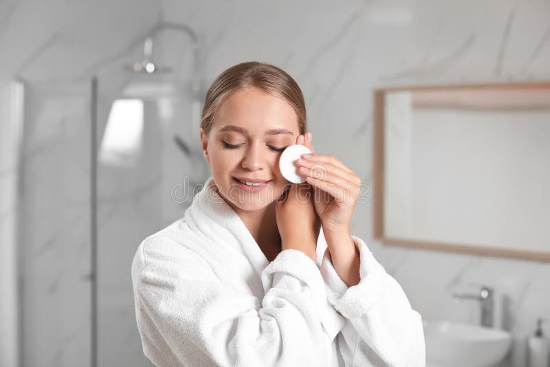 Beautiful young woman with cotton pad stock photography Beautiful young woman with cotton pad stock photography