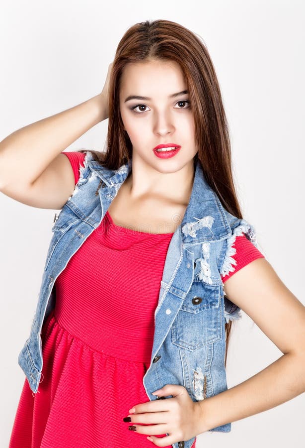 Beautiful Young Woman Dressed in a Red Dress Holding a Lollipop, Studio ...