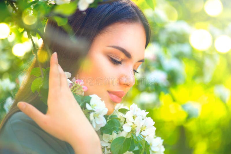 Beautiful young woman enjoying spring nature