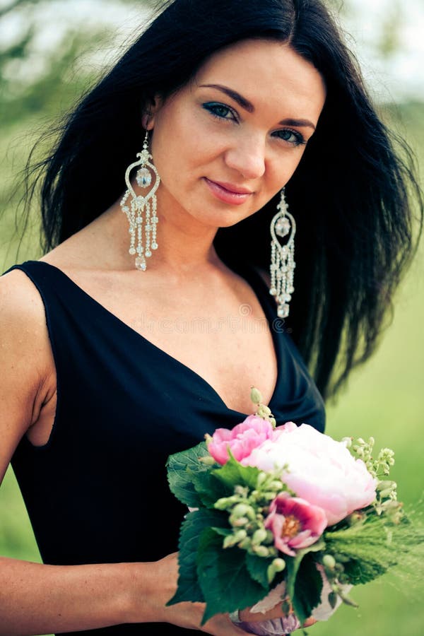 Beautiful young woman with flower