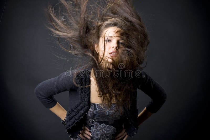 Beautiful young woman with flying hair