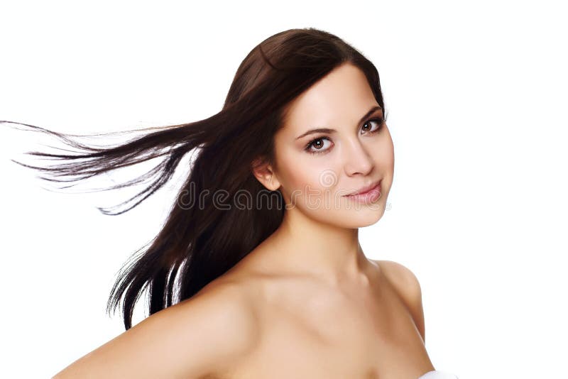 Beautiful young woman with hair flying