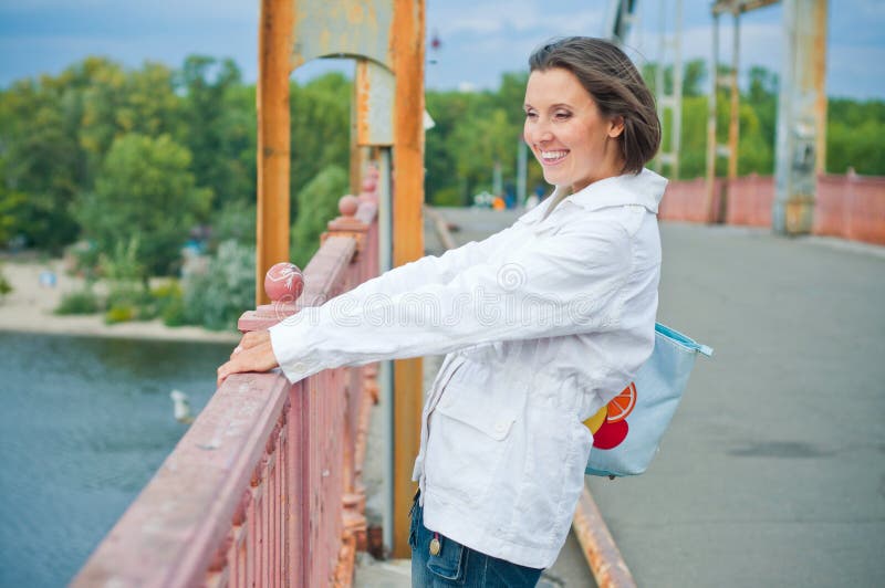 Beautiful young woman having fun in the autumn